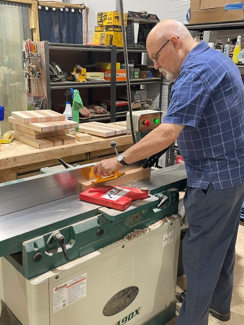Wayne at the saw crafting in his woodshop